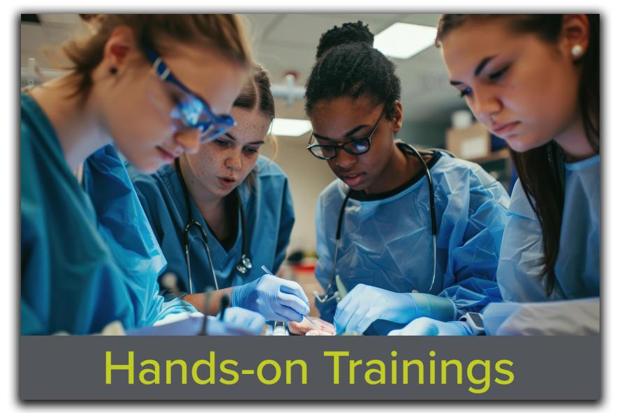 Block featuring an image of students and researchers standing around a table during a training session, with the text "Hands-On Training" overlaid, showcasing Tufts CMS's comprehensive research training programs.
