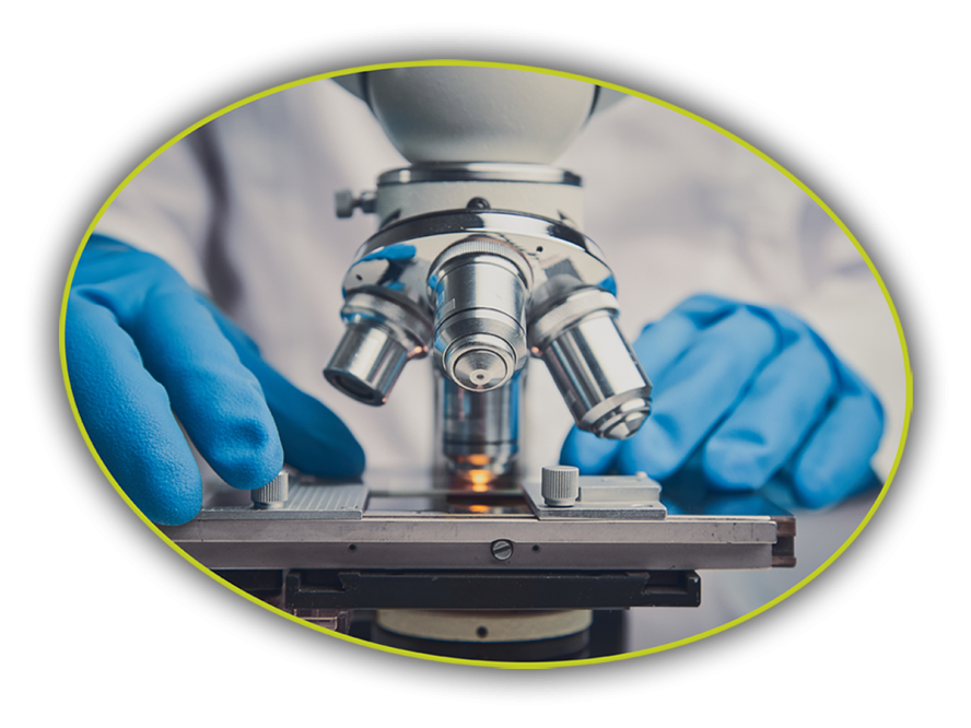 Close-up of a microscope with a metal lens, representing precision equipment used in Tufts CMS research spaces.